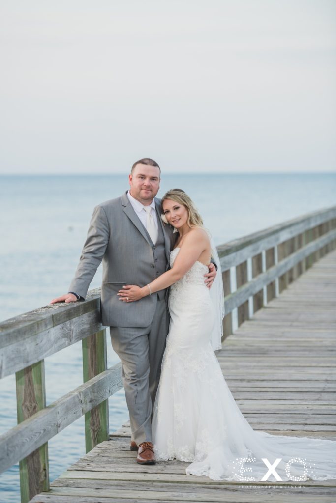 bride and groom smiling on the dock