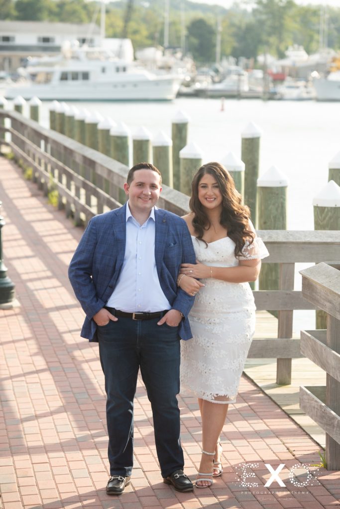 couple smiling on the boardwalk at Harbor Club at Prime