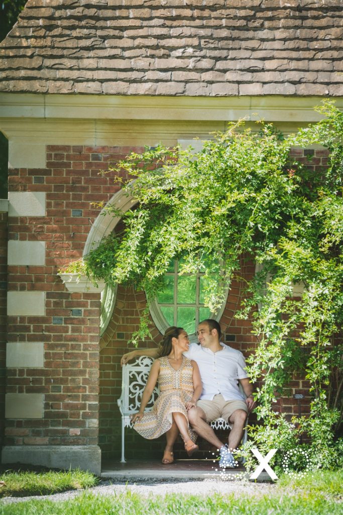couple sitting on a bench at Old Westbury Gardens