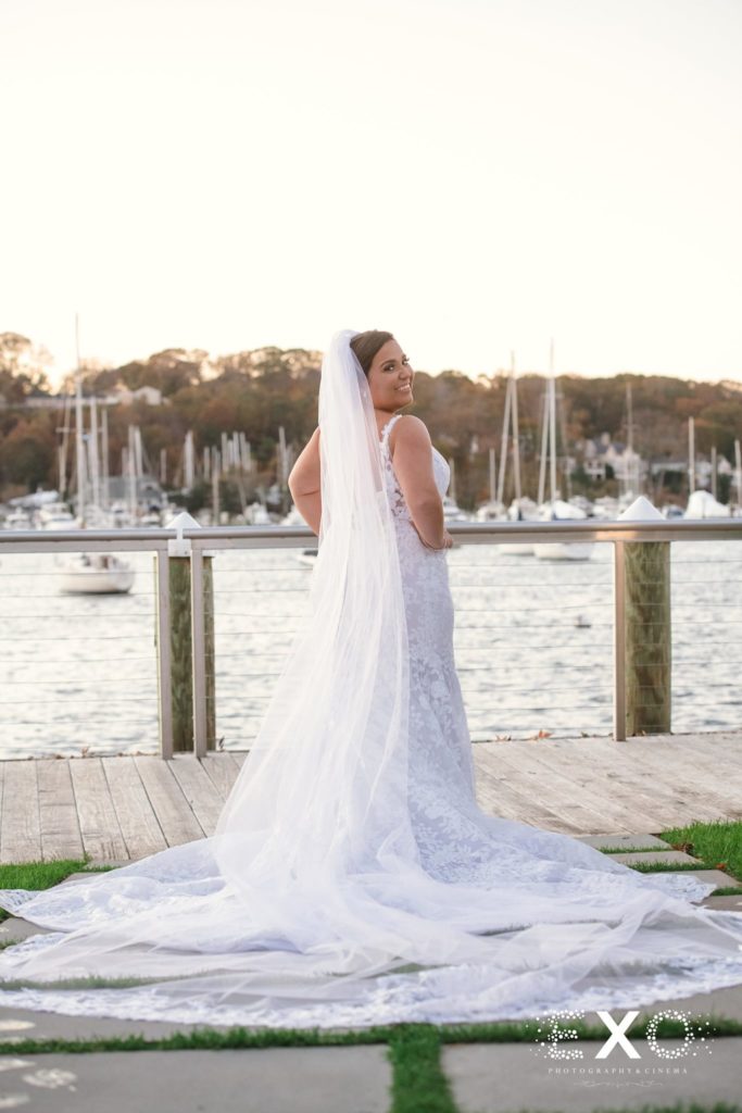 stunning bride posing on the deck at Harbor Club at Prime