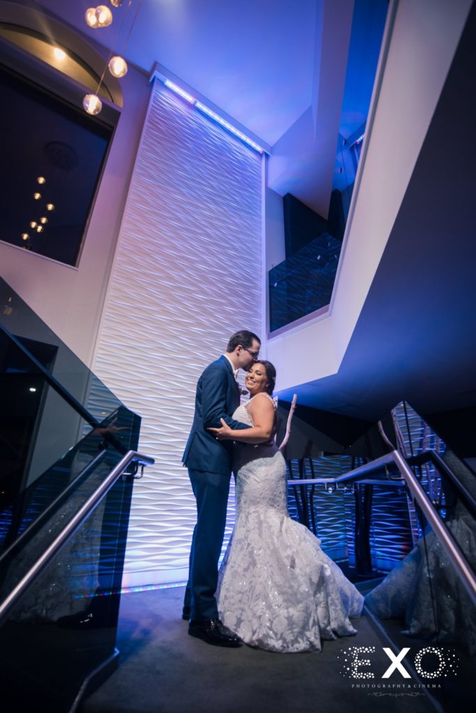 bride and groom standing on the stairs at Harbor Club at Prime
