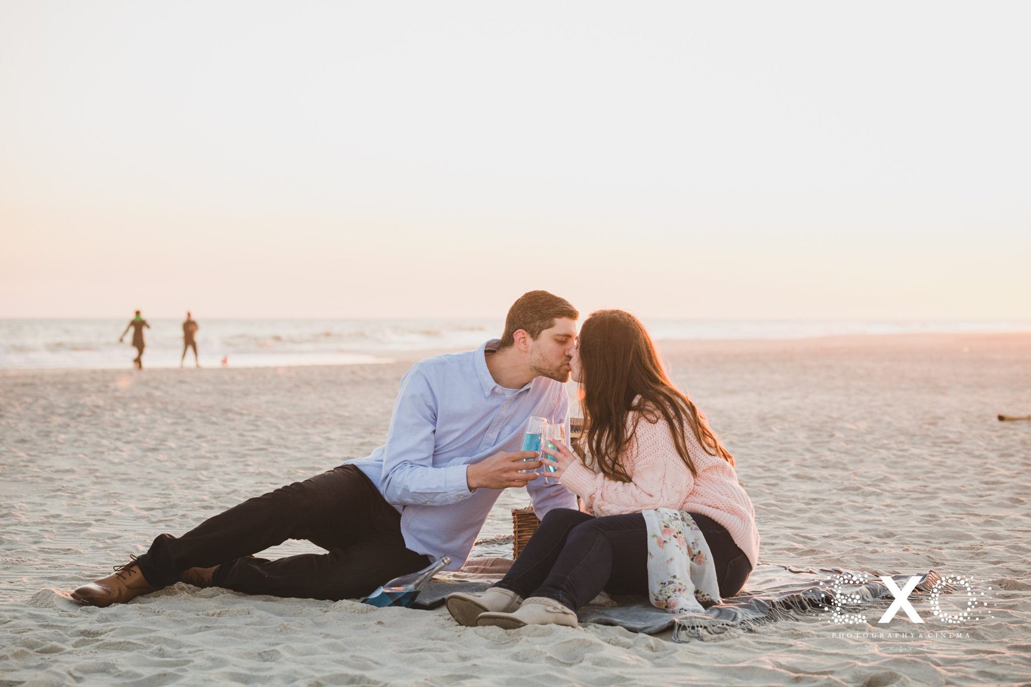 couple kissing in the sand