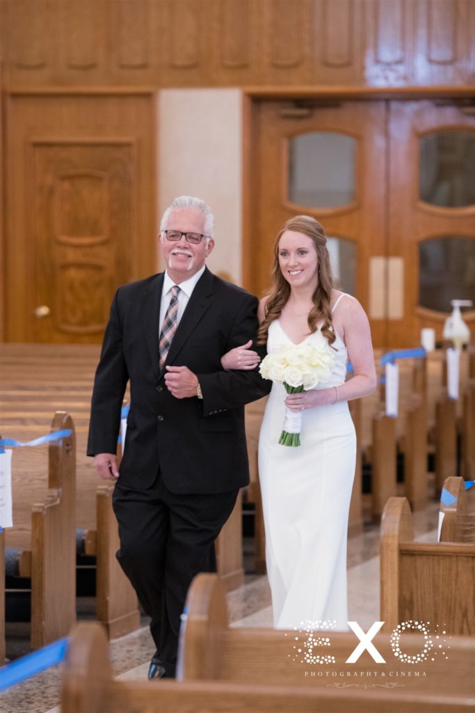 bride's father walking her down the aisle