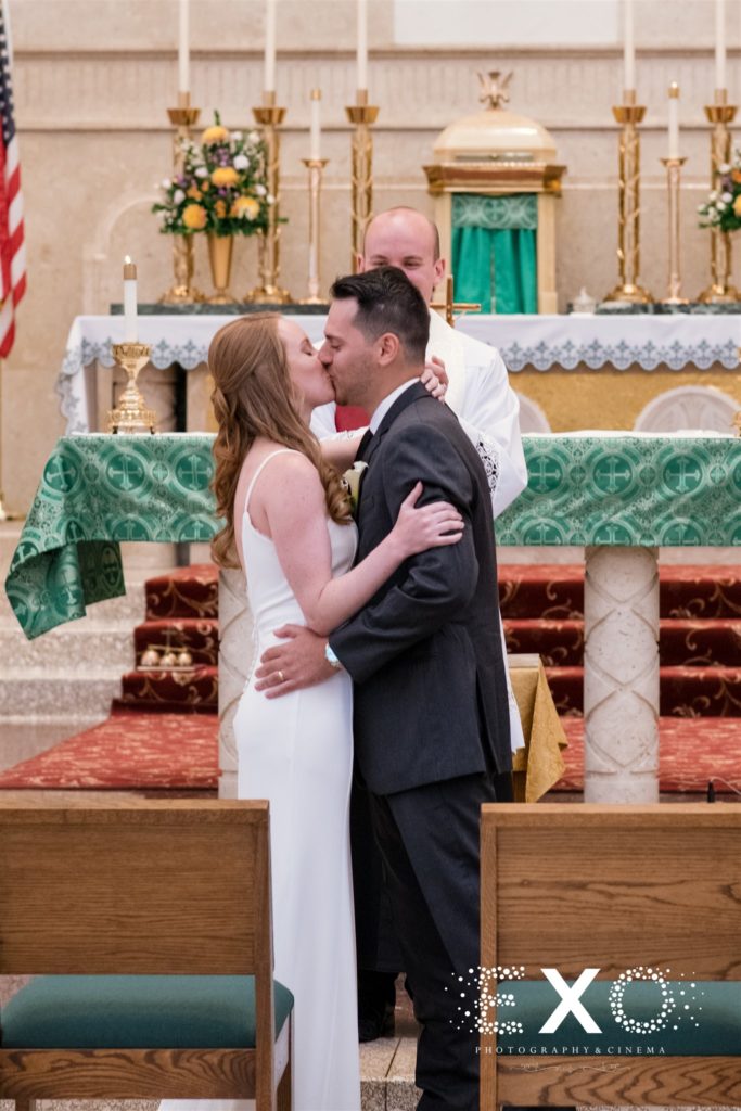 bride and groom kissing "I do"