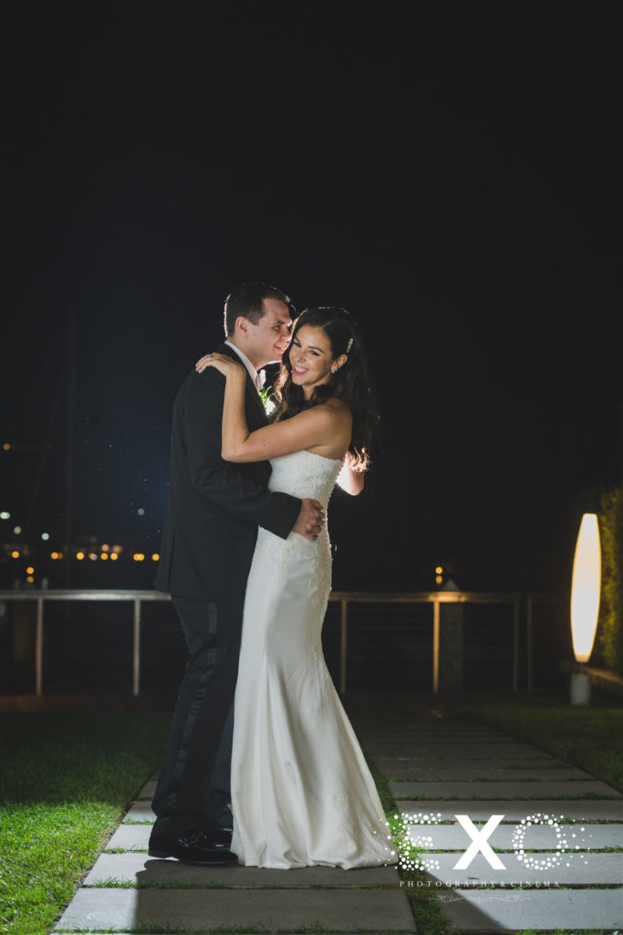 Night shot with the bride and groom during a Fall wedding at Harbor Club at Prime