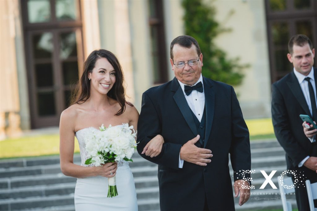 bride and dad walking down aisle