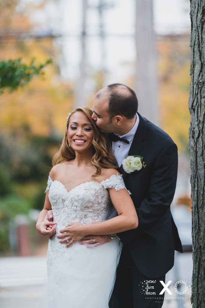 bride and groom kiss on cheek Intimate Fall wedding with Zoila and Carson