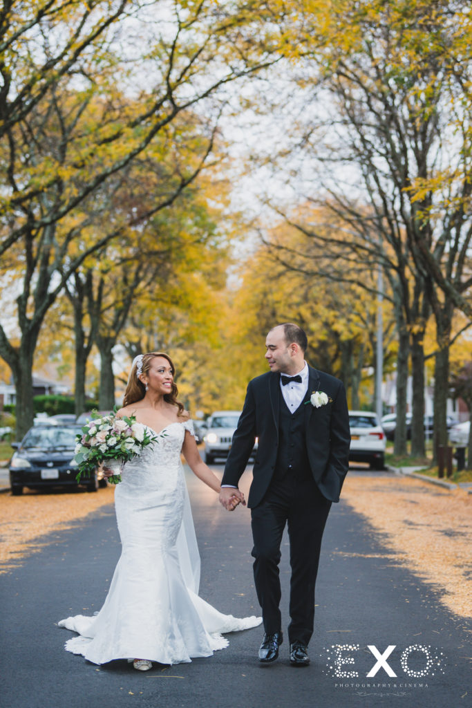 bride and groom walking holding hands after their Intimate Fall wedding with Zoila and Carson