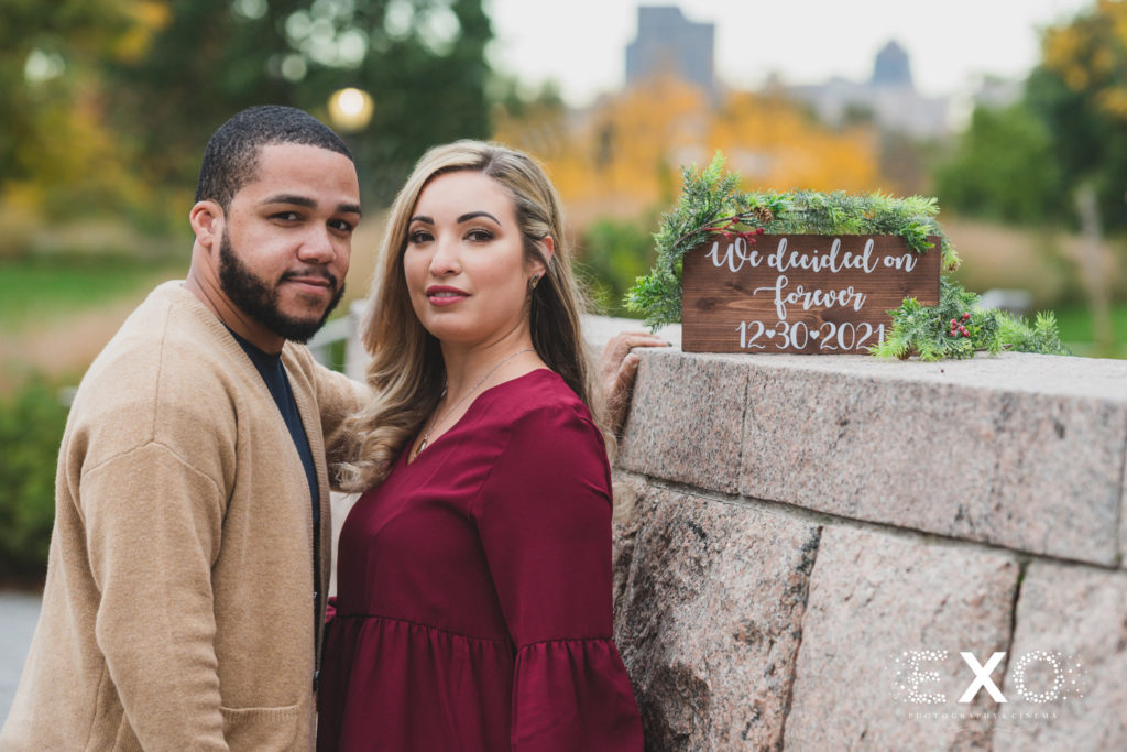 Gantry Park engagement session with a custom sign for the wedding date