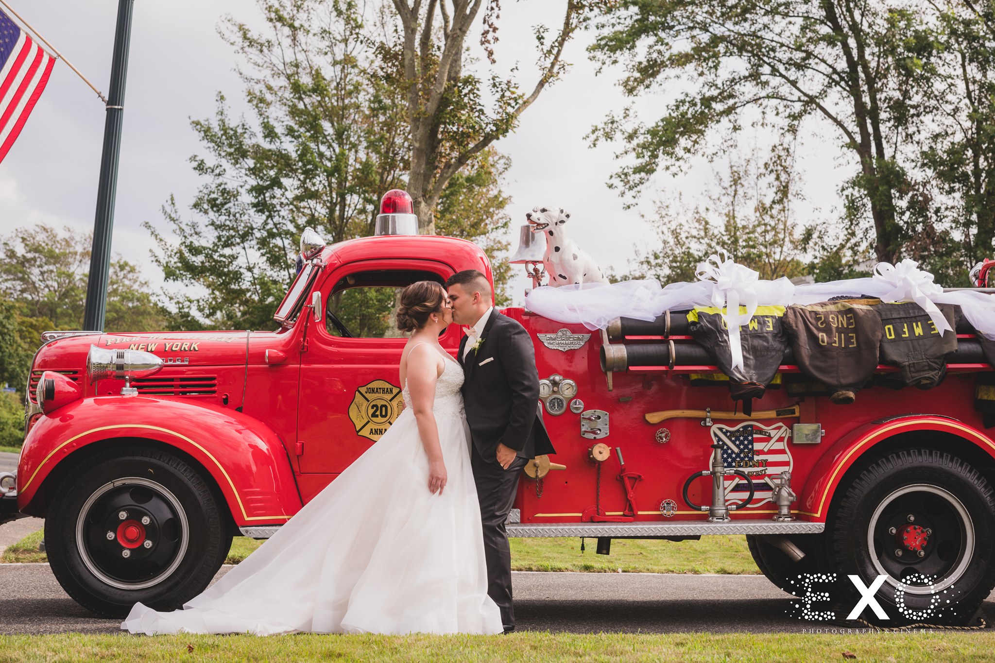 kissing in front of fire truck