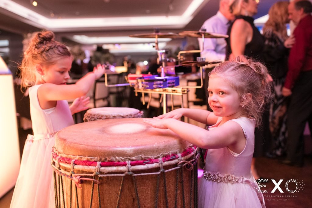 little girls playing drums