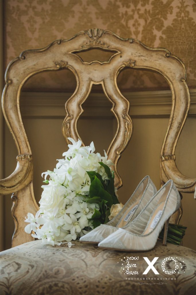 shoes and flowers on chair