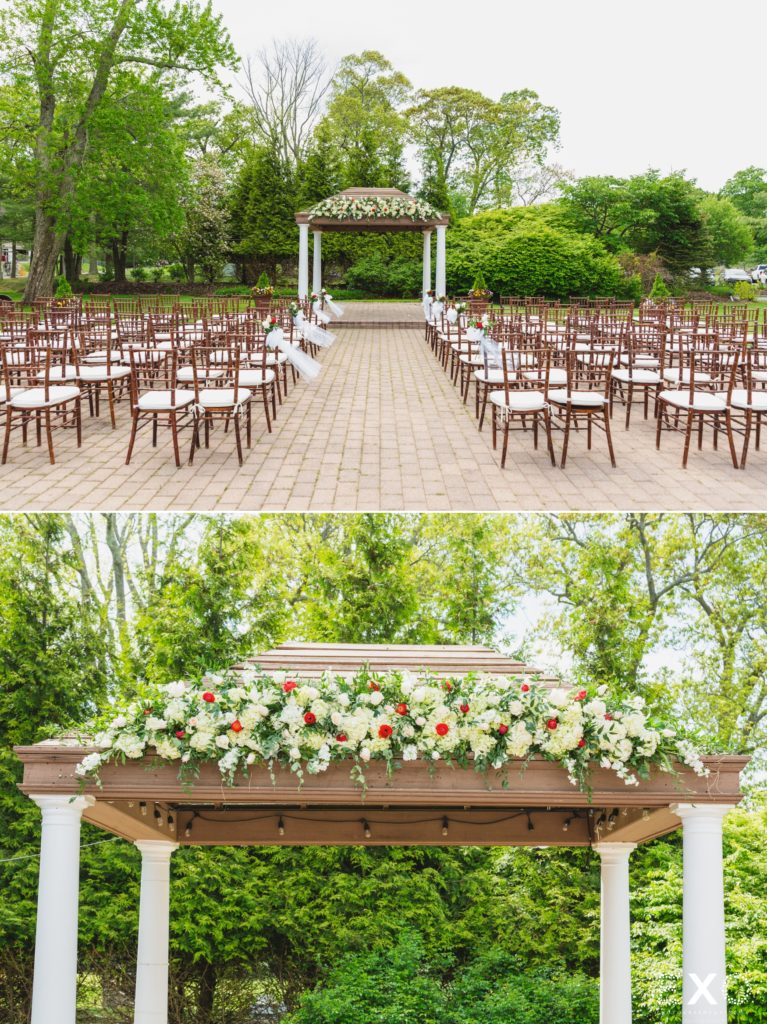 Chairs with flowers lining the aisle.