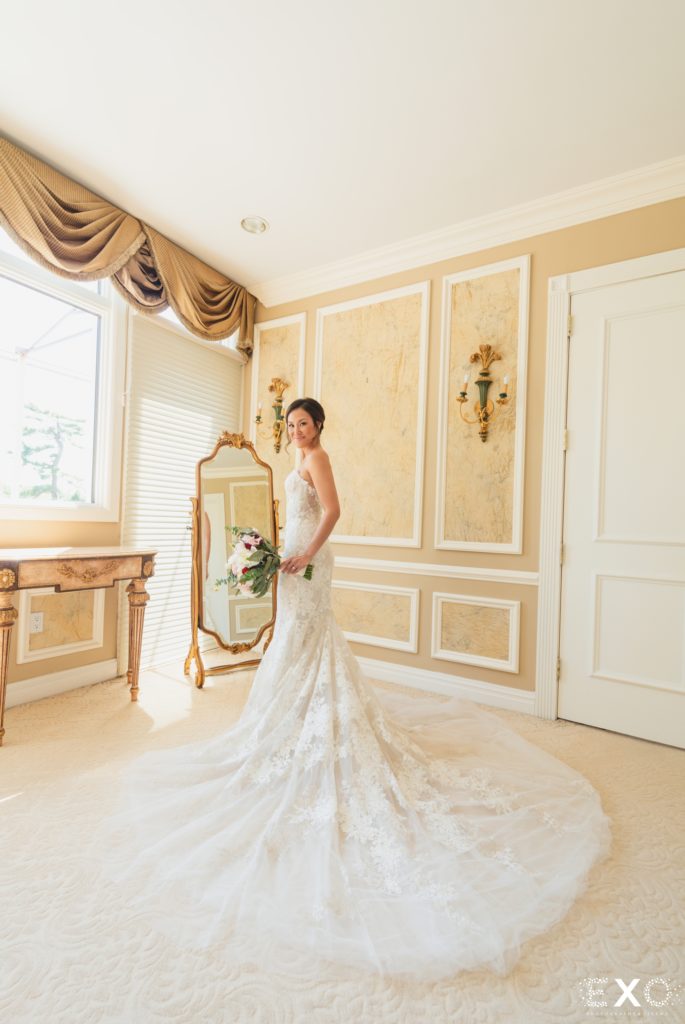 Bride in front of mirror.