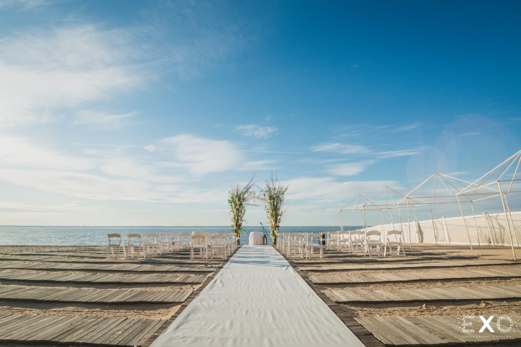 Chuppah and chairs with the view of the beach.
