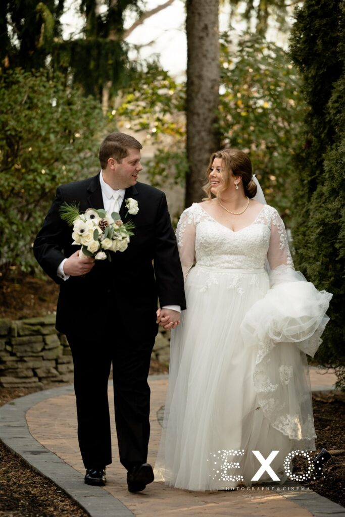 Bride and groom walking at Fox Hollow