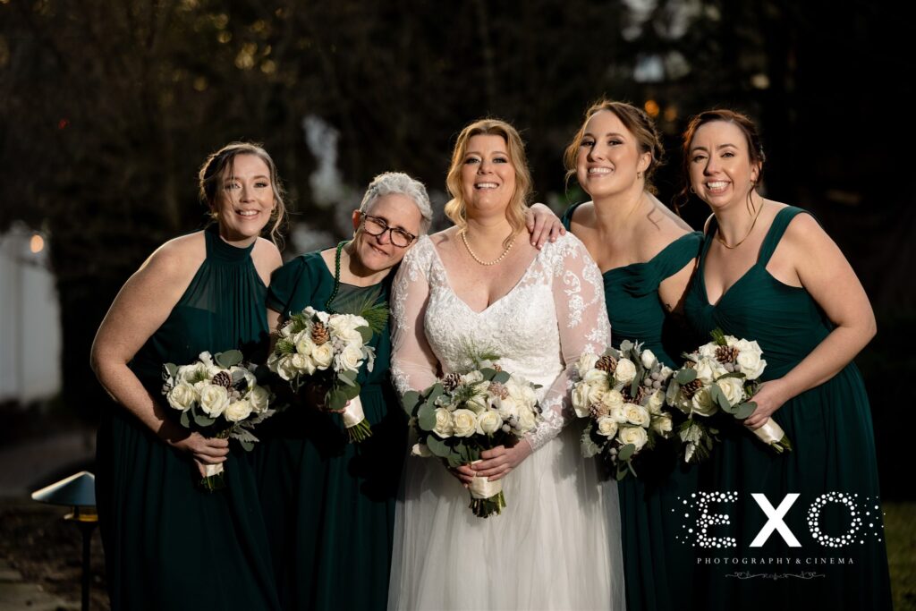 Bride and her bridesmaids with hunter green