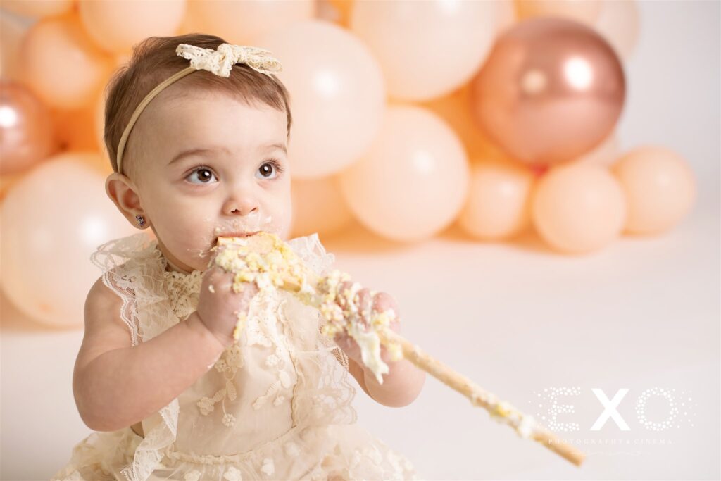 close up photo of little girl eating cake