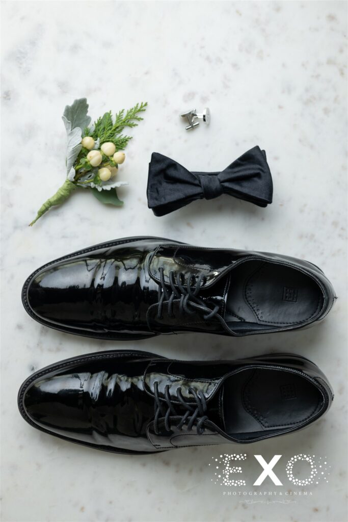 groom's shoes bow tie and boutonniere