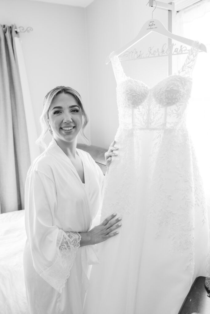 black and white photo of the bride with her dress 