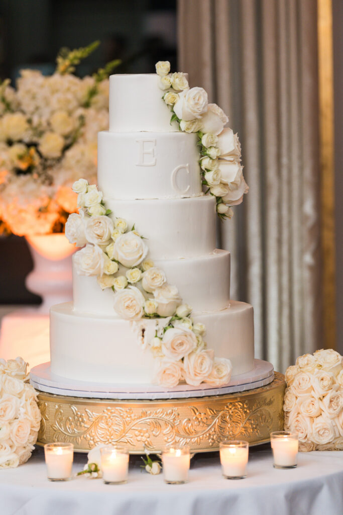 White wedding cake with white flowers at Water's Edge