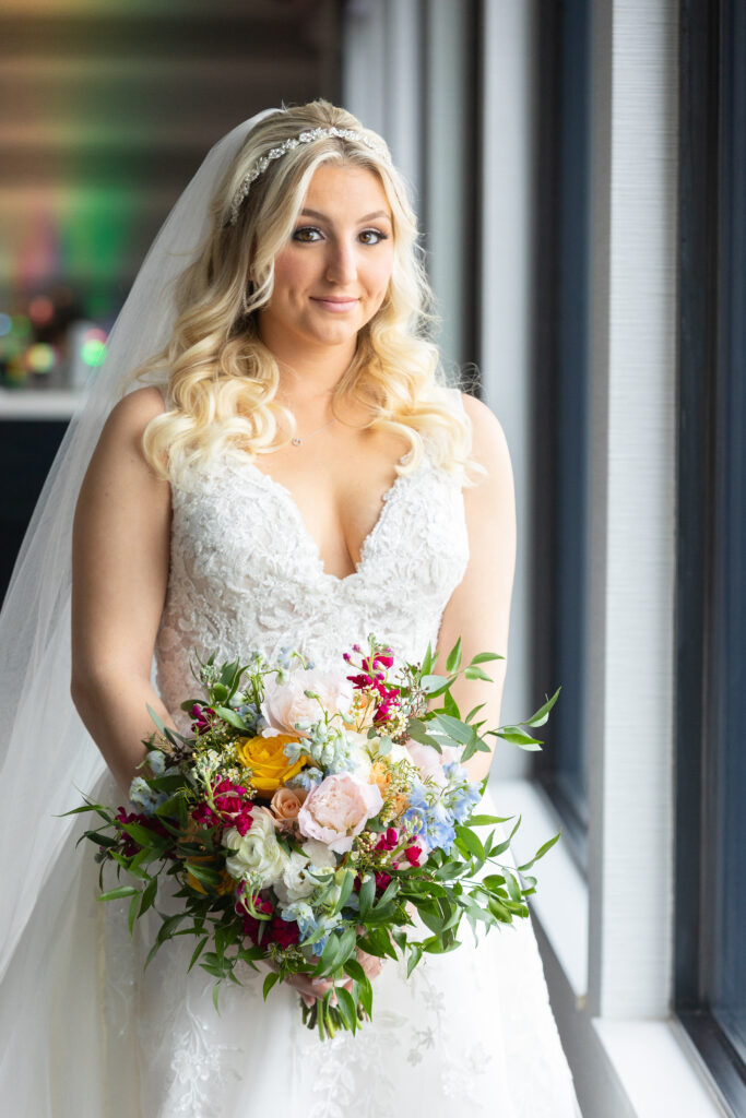 Bride with colorful bouquet at Harbor Club at Prime