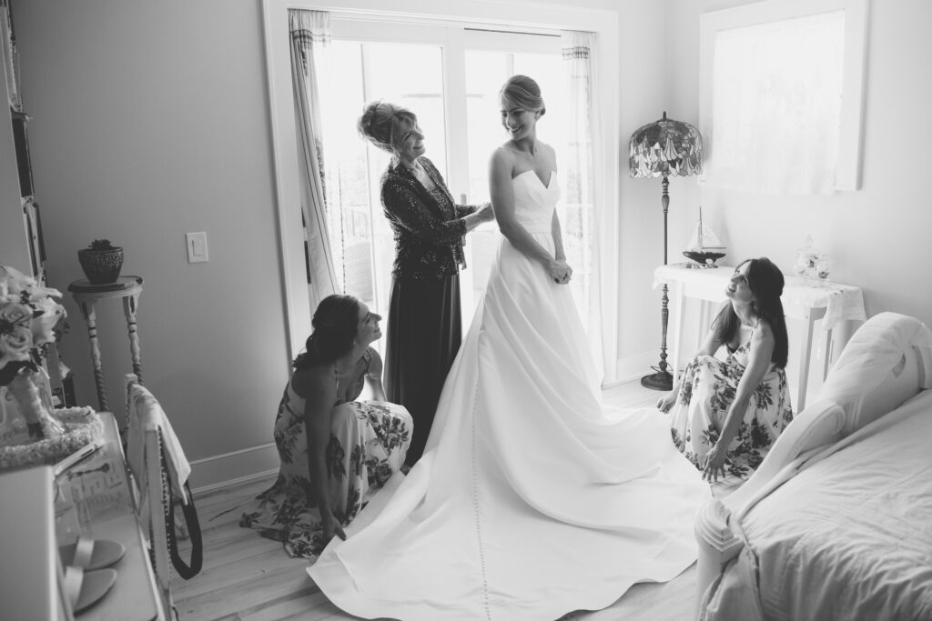 black and white photos of bride and mom getting ready for the wedding