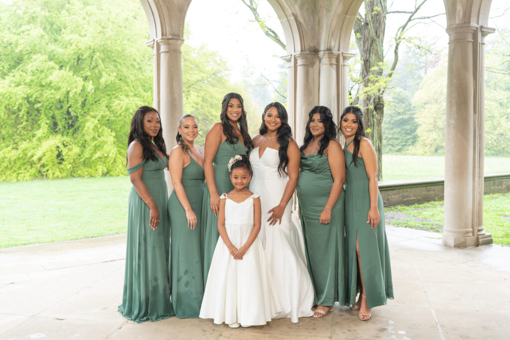 The bride and her bridesmaids in sage