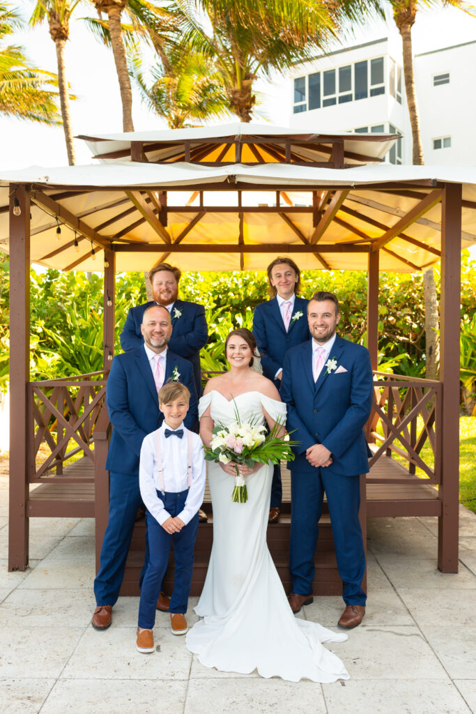 The groomsmen with the bride at Tideline ocean resort and spa