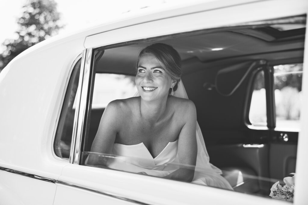 Bride looking out the car 