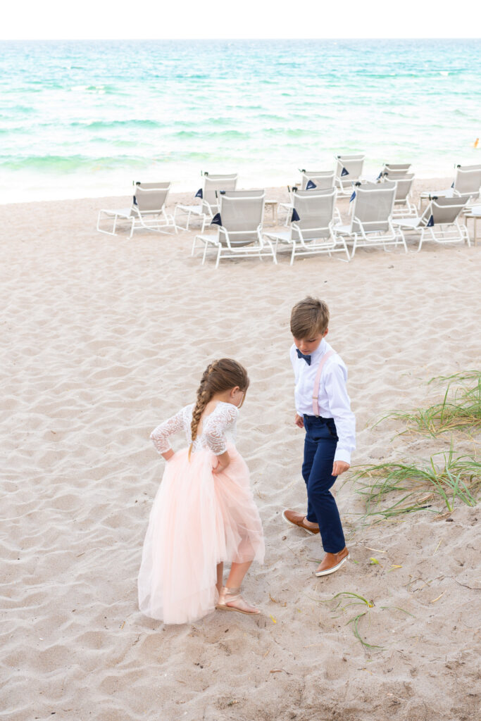 Flower girl and ring bear on the beach