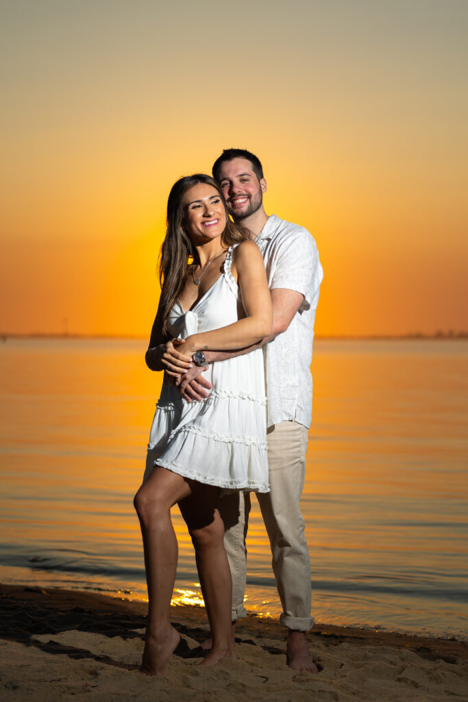 Sunset on the water at Robert Moses beach engagement photos