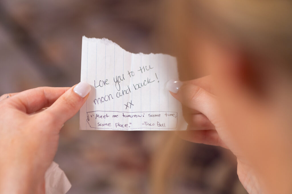 Bride holding a paper note
