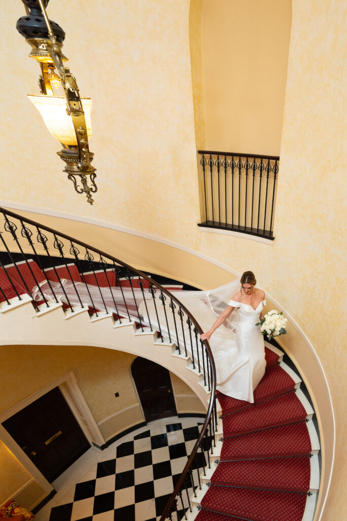 bride walking down the stairs at The Woodside Club