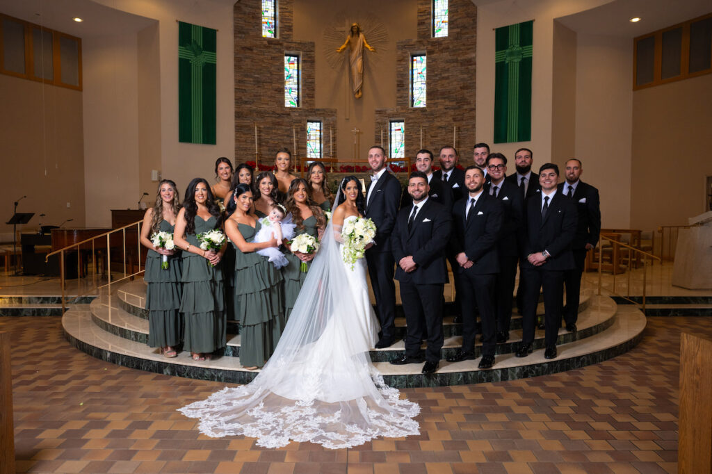 Bride and groom with their bridal party at church