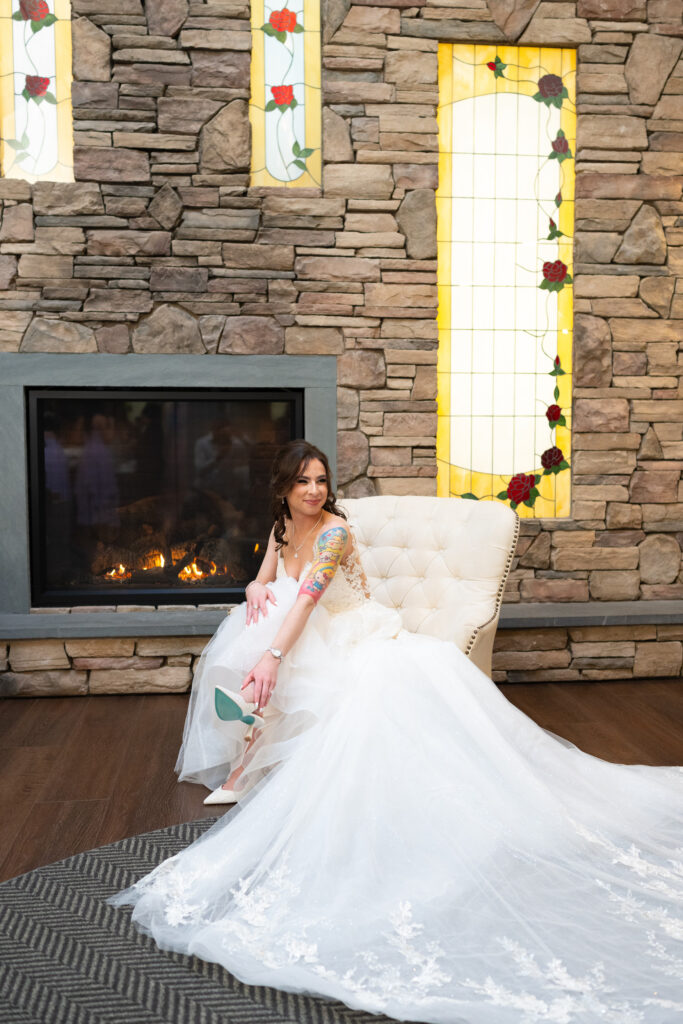 Bride putting on her shoes at Flowerfield Celebrations