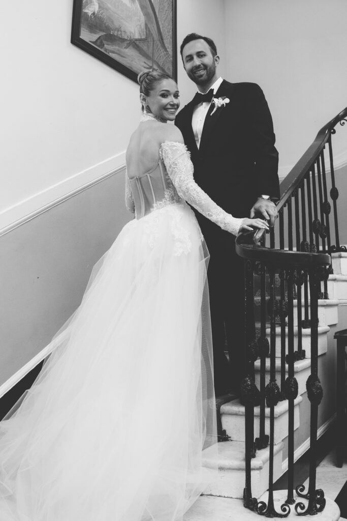 Bride and groom at the steps of The Mansion at Oyster Bay