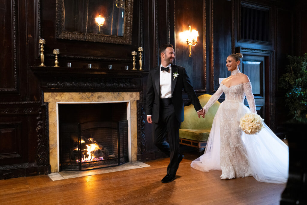 Bride and groom at the fireplace room of The Mansion at Oyster Bay