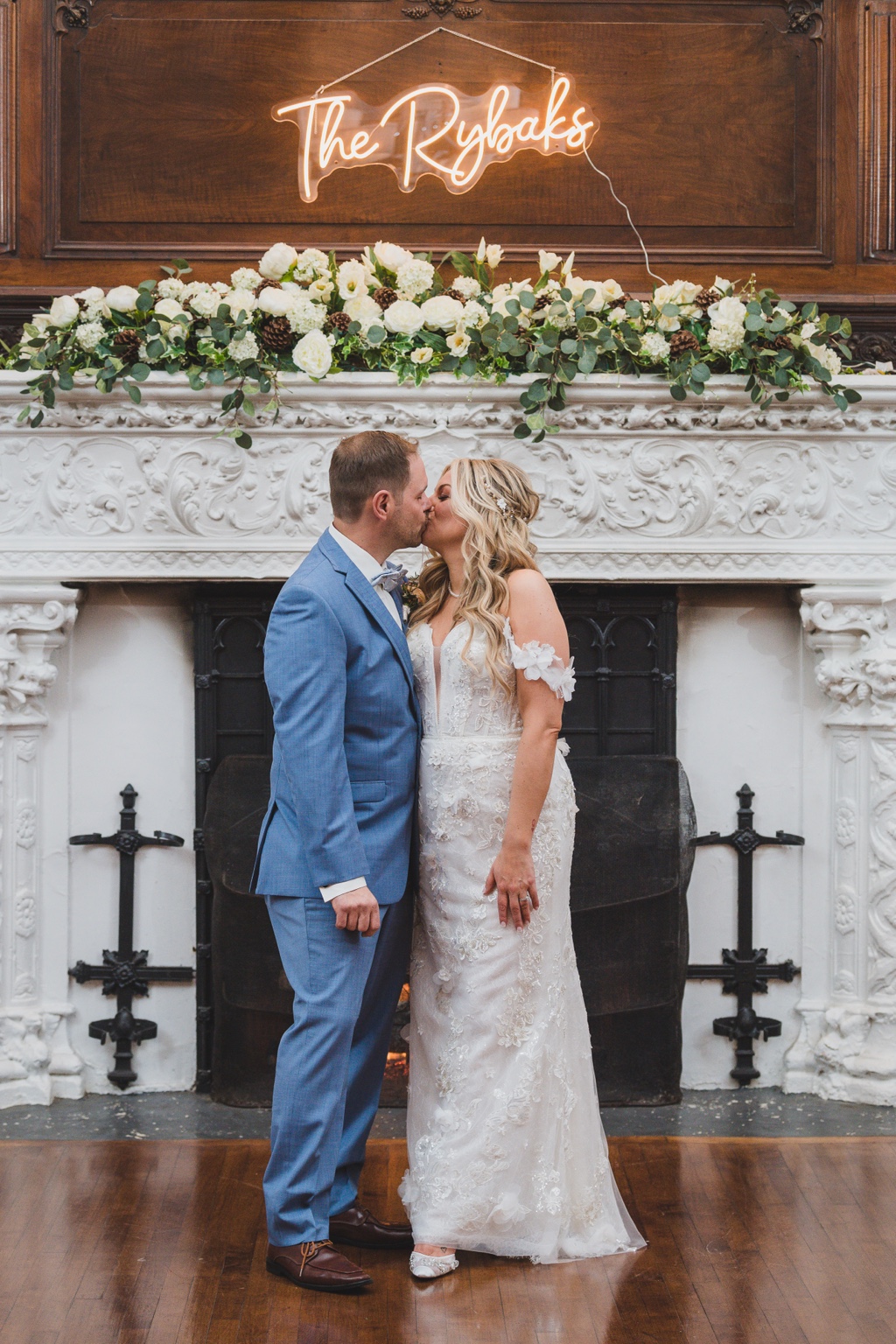 Couple at reception fireplace