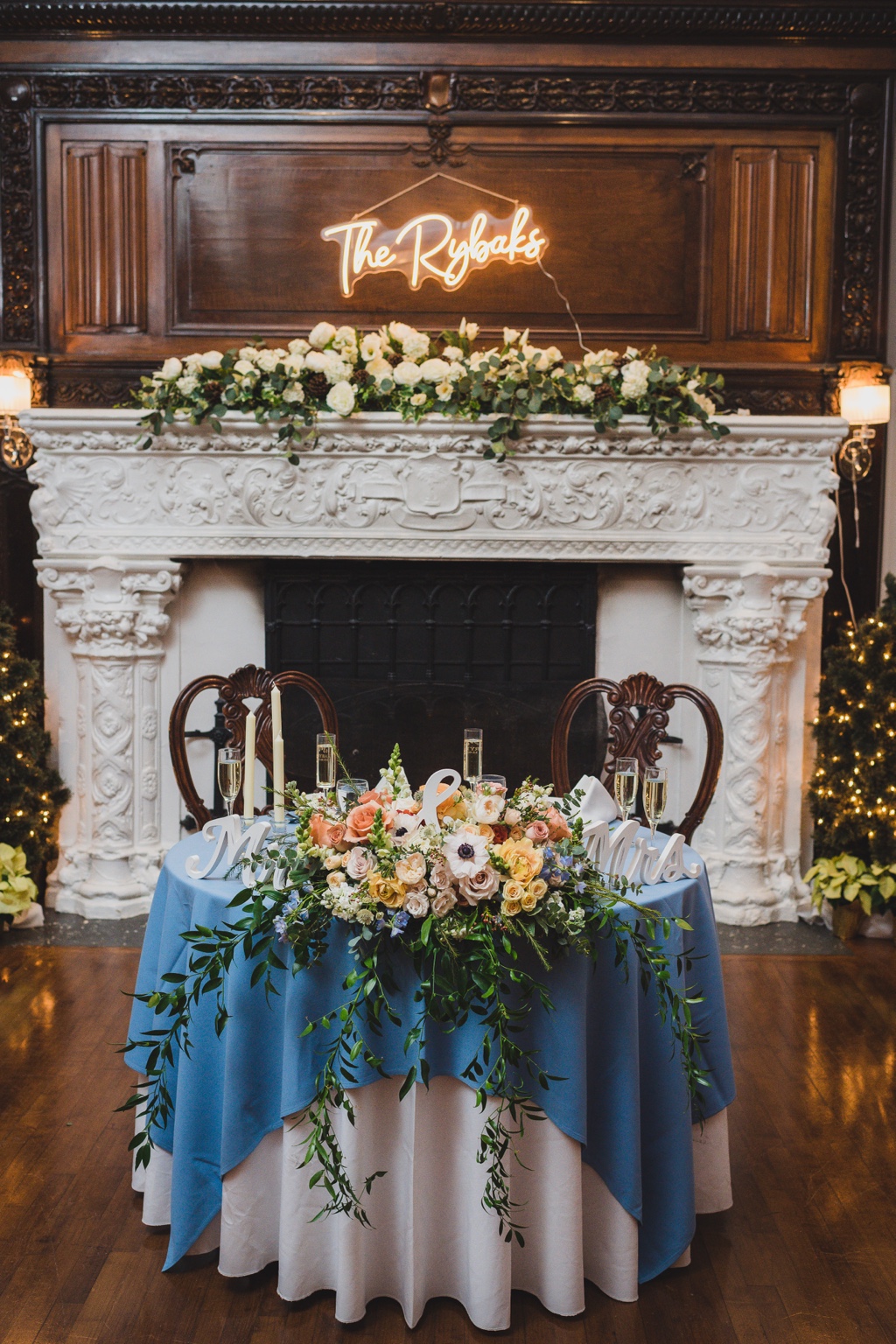 Couple kissing by fireplace