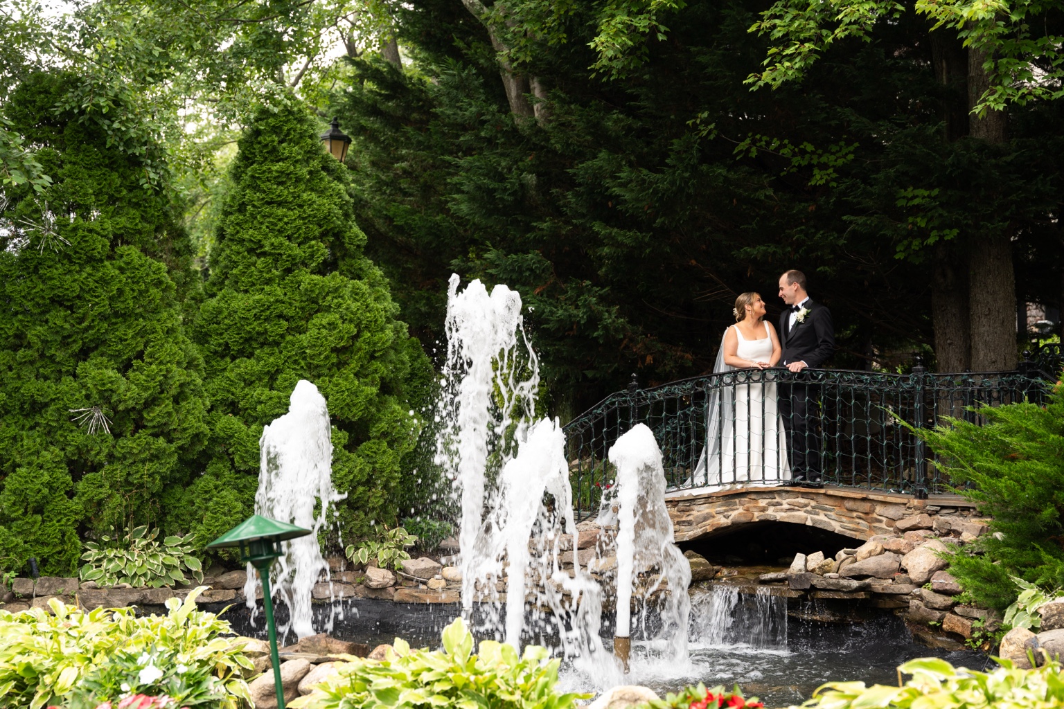 Fox Hollow wedding couple at garden fountain