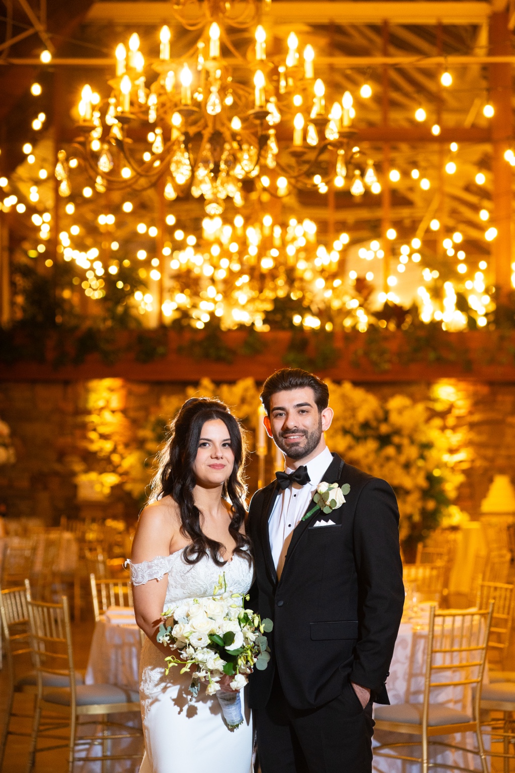 Fox Hollow couple in chandelier-lit ballroom