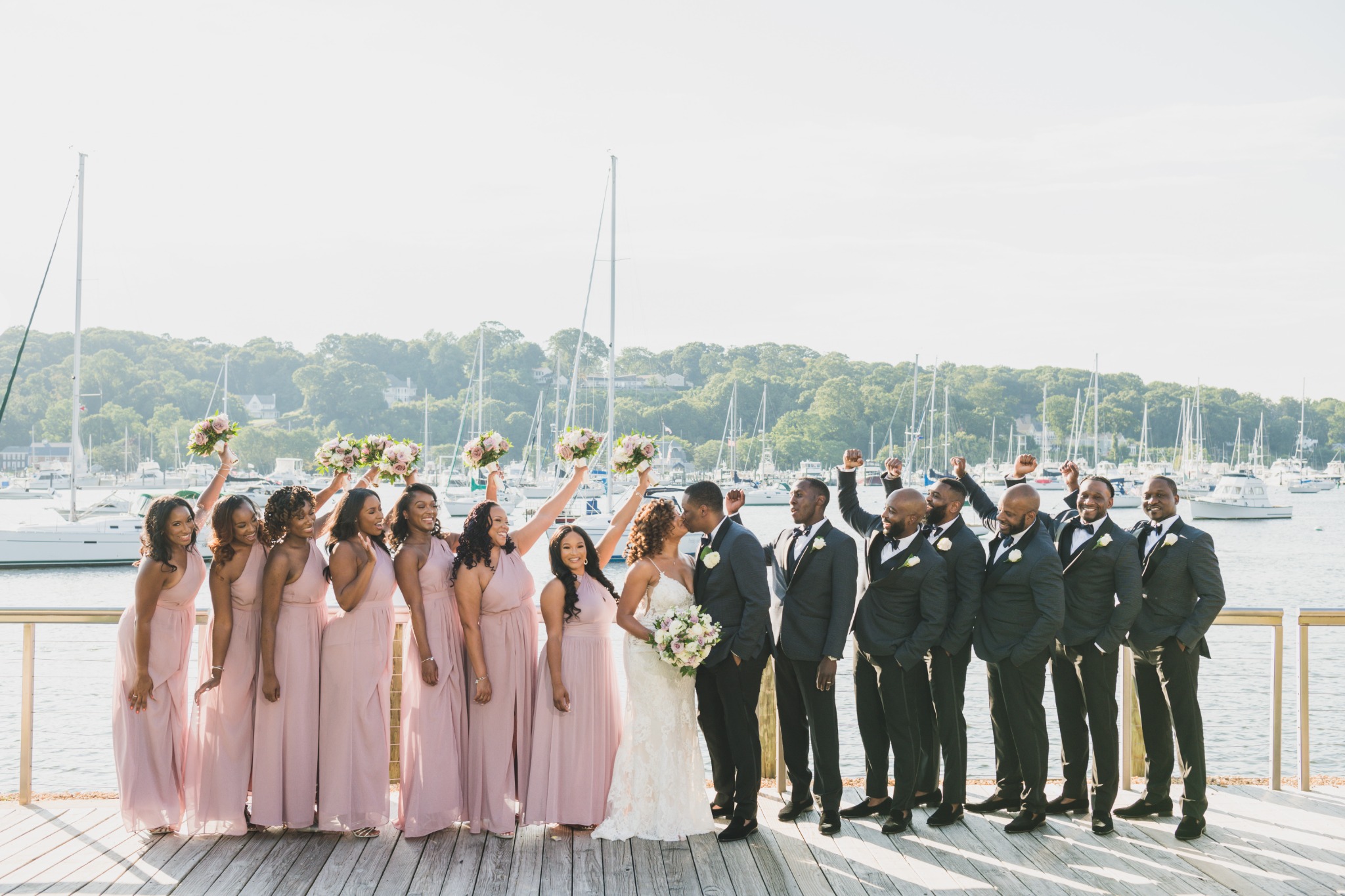 Harbor Club at Prime wedding party photographed on the deck overlooking Huntington Harbor
